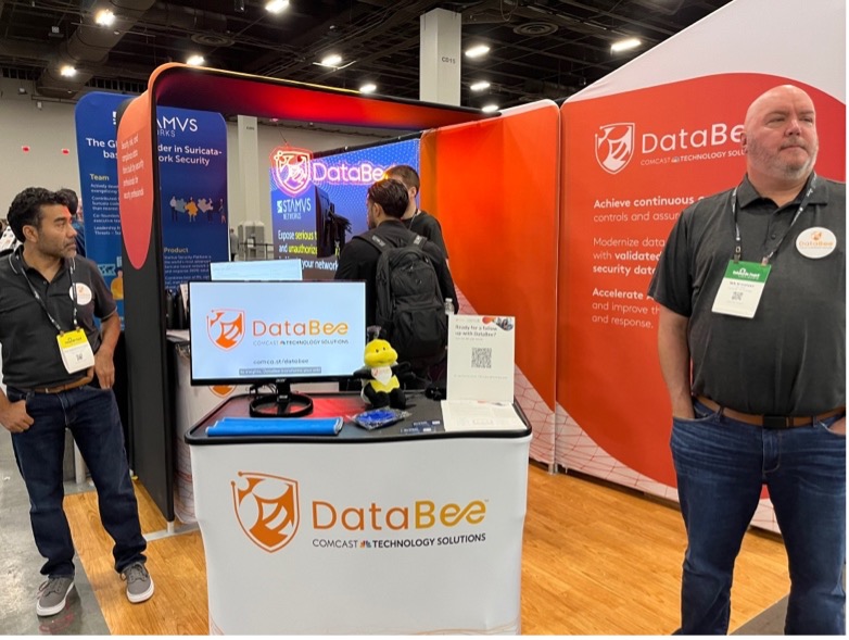 Man standing by Databee booth at Black Hat 2023