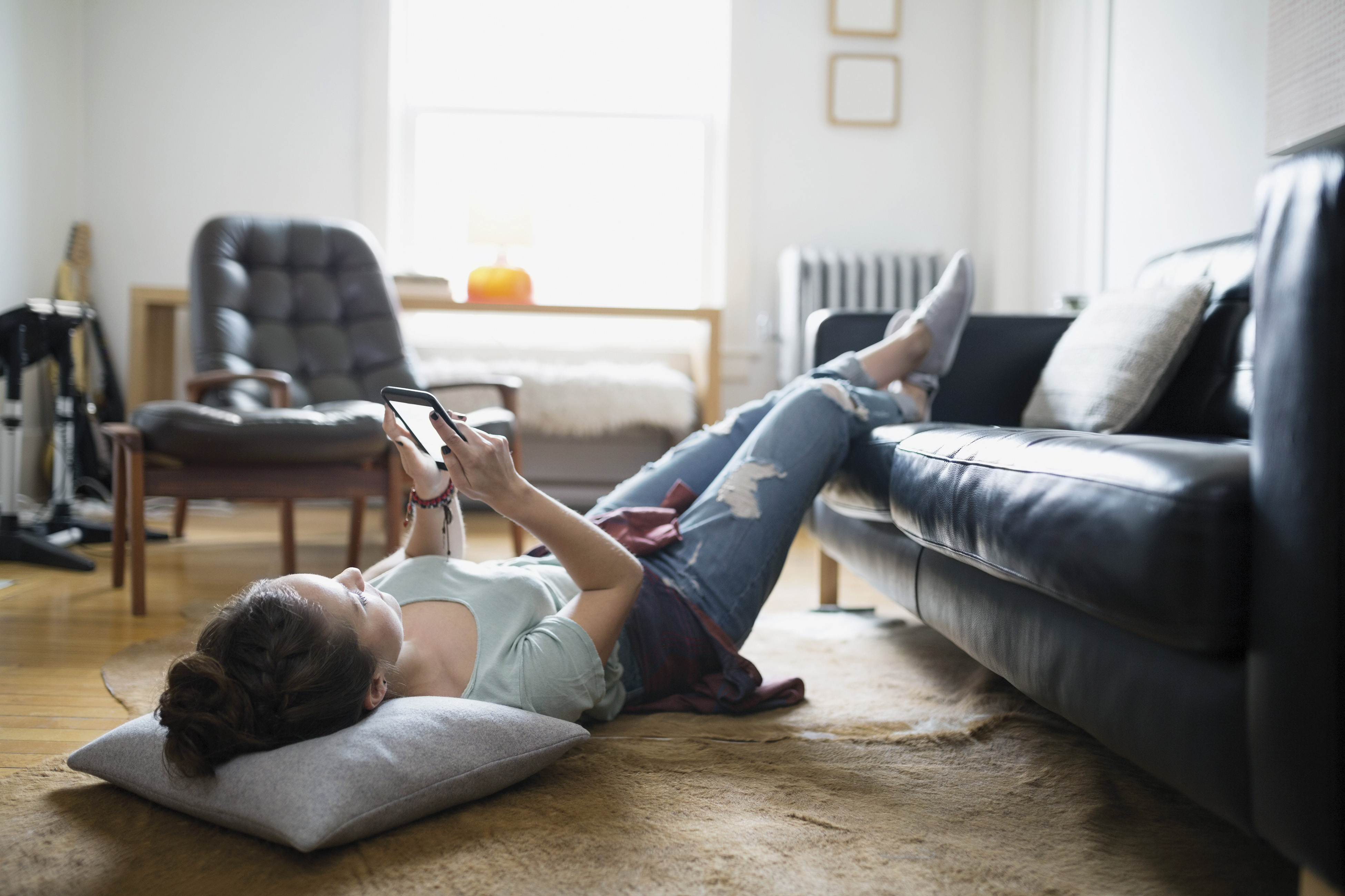 woman relaxing with phone